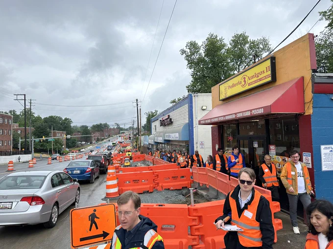 Construction barriers in front of businesses on Piney Branch Road.