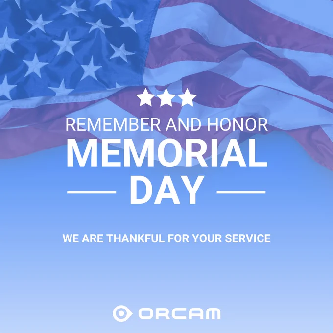 An image featuring the American flag against a blue backdrop, accompanied by the words 'Remember' and 'Honor Memorial Day.' We express our gratitude for your service. The OrCam logo is positioned at the bottom.