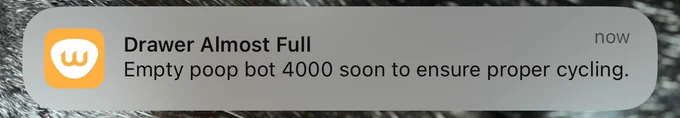 An iOS notification that says: Drawer Almost Full. Empty poop bot 4000 soon to ensure proper cycling.