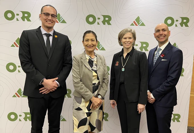 Secretary Haaland poses with members of the Outdoor Roundtable.