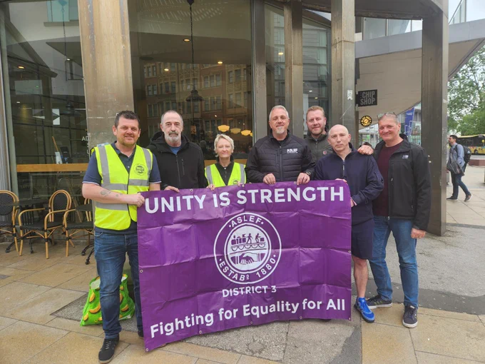Pickets and supporters with aslef picket signs