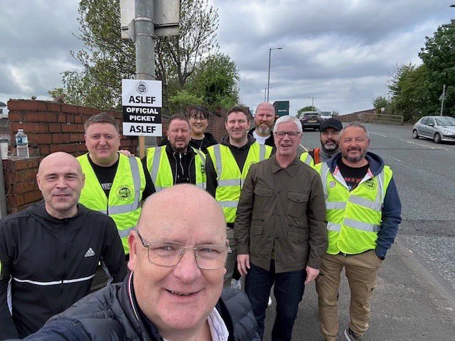 Pickets and supporters with aslef picket signs