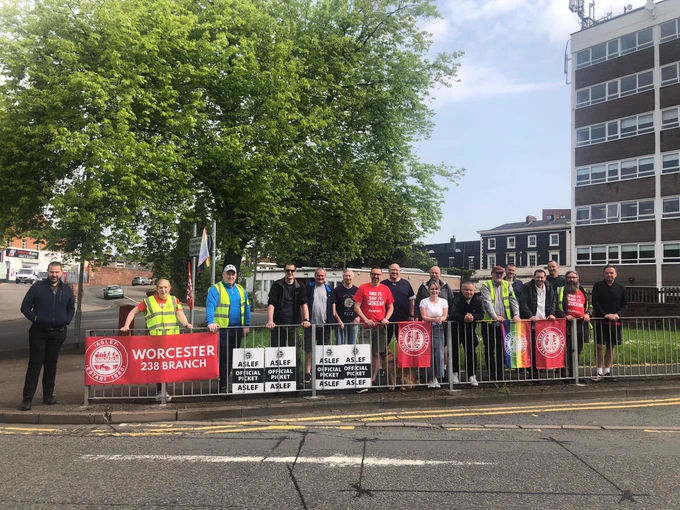 Pickets and supporters with aslef picket signs