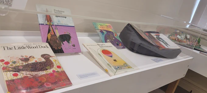 Brian WIldsmith books on display in a case in the Archives reception 