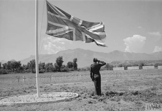 An RAF airman, on his way from Naples to Rome on VE Day, pauses at the British cemetery at Minturno to pay tribute to his fallen comrades.