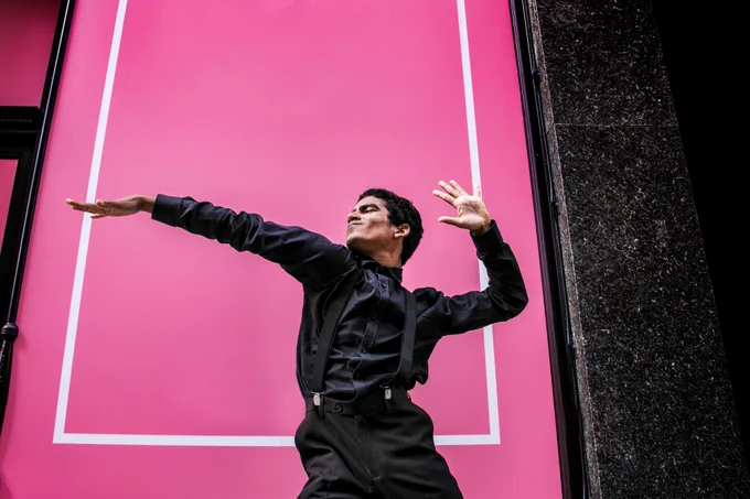 Image of young man dancing in front of a bright pink panel.
Photo credit: Dani Bower Photography for One Dance UK.