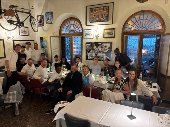 Image of a group of American players having dinner in Rome