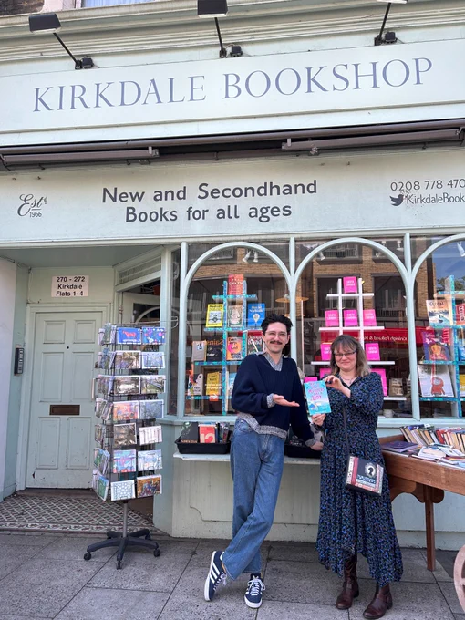 Author Hannah Dolby stands outside Kirkdale Bookshop Sydenham