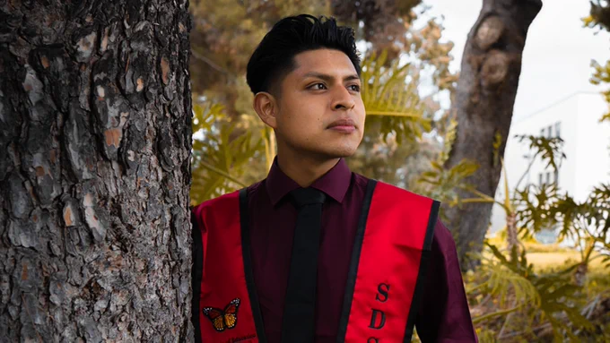 Javier Diego Jancinto standing in the trees on the SDSU campus