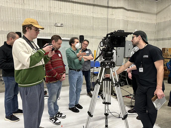 people watch camera person use camera