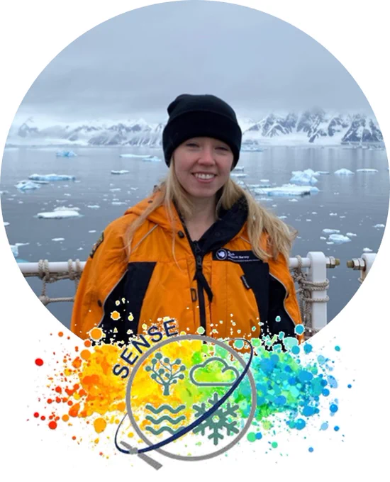 Charlotte on the Sir David Attenborough (i.e. Boaty McBoatFace) travelling down the Antarctic Peninsula. Antarctic coastline with icebergs floating in the sea behind
