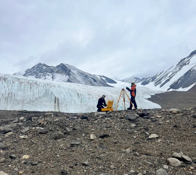 Charlotte setting up the Trimble DGPS base station for our UAV flights next to Canada Glacier, Taylor Valley, Antarctica 