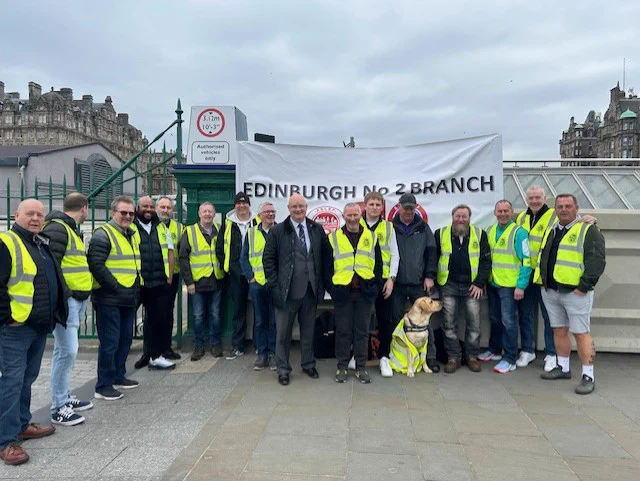 pickets and supporters in front of Edinburgh Waverley station