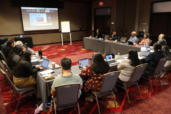 Meeting participants gather around a horseshoe-shaped conference table at Desert Diamond Casino.