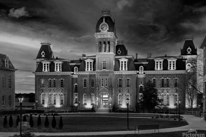 Dramatic black and white monochrome image of Woodburn Hall at West Virginia University or WVU