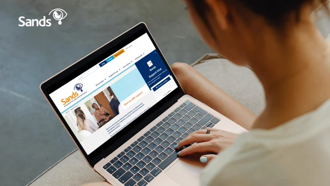 Image of someone accessing GriefChat on their laptop.