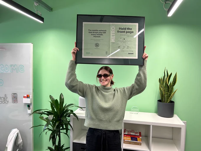 Anna holding up one of our front page spreads