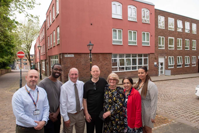 Photo shows left to right: John Roseblade, Director of Resident Services at City of Wolverhampton Council, Peter Bilson House resident Stephen Joseph, Councillor Steve Evans, Deputy Leader and Cabinet Member for Housing, Peter Bilson House resident Leeroy Haynes, Nicky Bilson, Councillor Jasbir Jaspal, Cabinet Member for Adults and Wellbeing and Stephanie Holland, P3 Service Coordinator outside Peter Bilson House.
