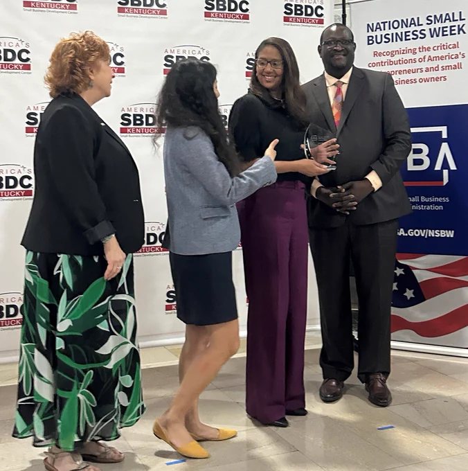 (Left to Right) Kristina Joyce, Kentucky SBDC State Director; Jennifer Kim, SBA Associate Administrator; Raquel Carter, Kentucky Woman-Owned Small Business of the Year; Robert Coffey, SBA Kentucky District Director. 