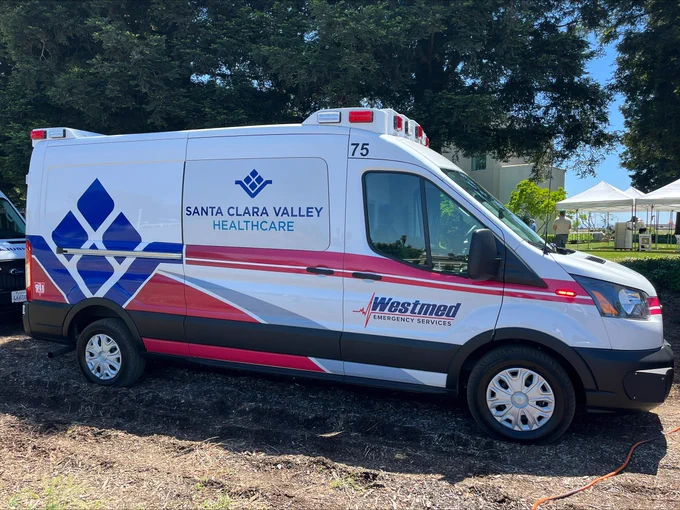 a picture of an ambulance. The writing on the side panel says Santa Clara Valley Healthcare