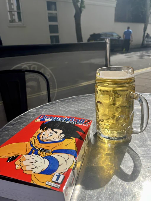 A pint of beer next to DragonBall Z Collection No. 1