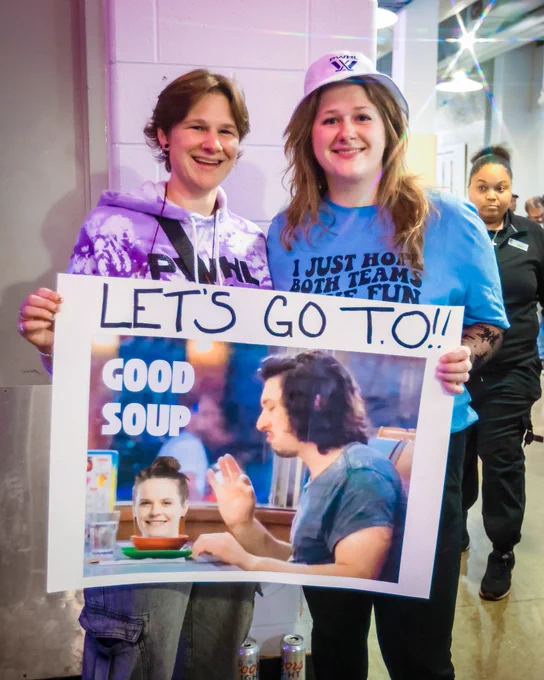Fans with a “good soup” sign.