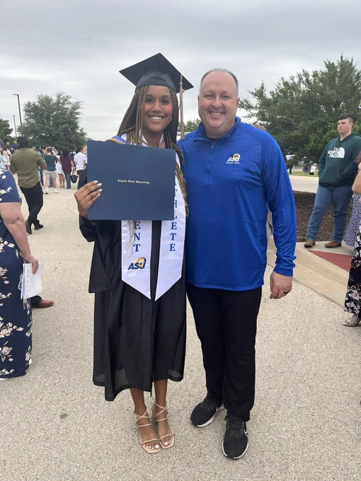 Belle volleyball player Maya Smalls and coach Waddington posing for a pic after graduation.