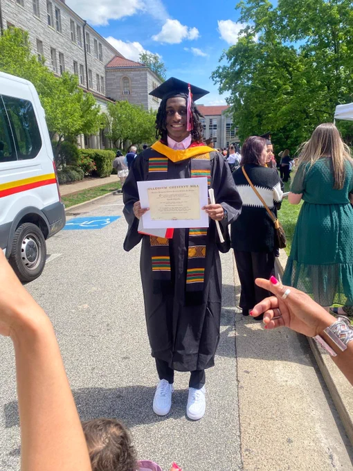 Young Noah Charles receiving his college diploma.