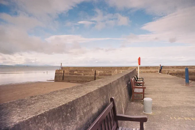 Colour photograph of Fisherrow Harbour wall and benches