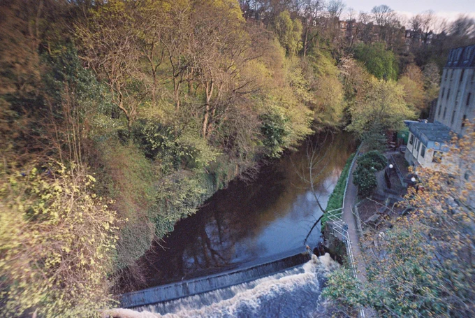 Colour photograph of a small weir on the Water of Leith 