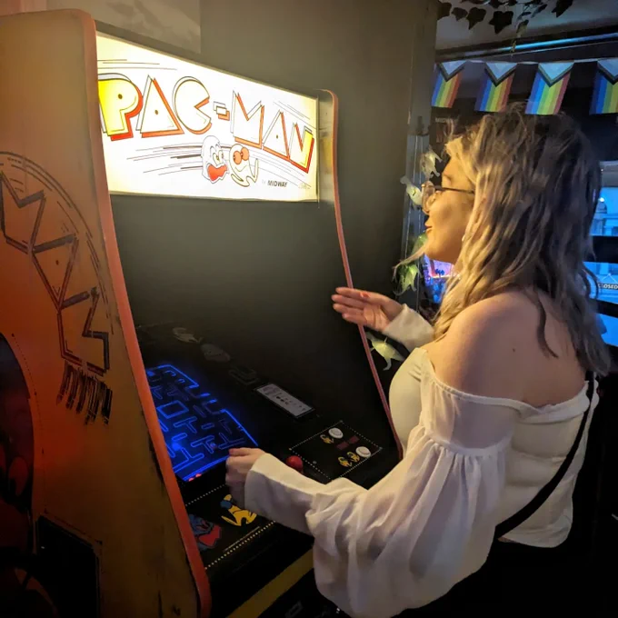 A lass playing Pac-Man