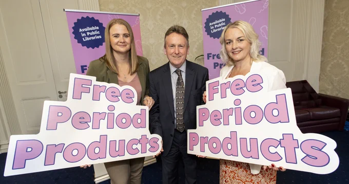 Image with three people - Junior Minister Aisling Reilly, Libraries NI Chief Executive Jim O'Hagan and Junior Minister Pam Cameron welcome the new legislation to provide free period products.