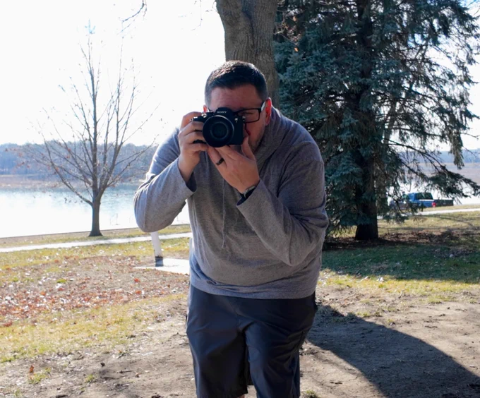 Taking a photo in a park for use on social media platforms