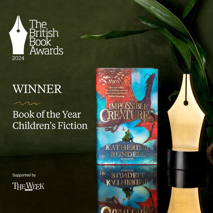 Impossible Creatures stood upright on a mirrored table next to the golden Nibbie trophy in front of a plant, in white text reads: winner, Book of the Year Children's Fiction