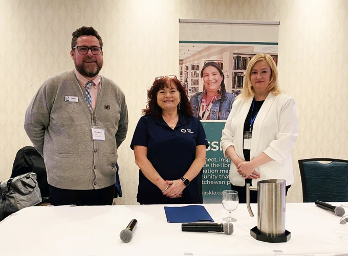 Mark Black, Nikki Langdon, and Patti-Lynne McLeod standing at a table.
