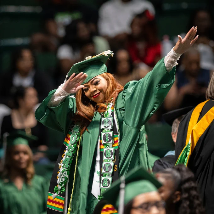 Graduate celebrating at a UNT Spring 2024 commencement ceremony.