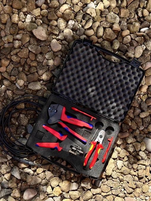 a tool kit on rocks