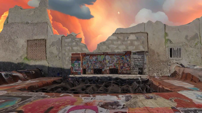 A broken wall, featuring lots of decal based street art which extends over the floor underneath your feet.