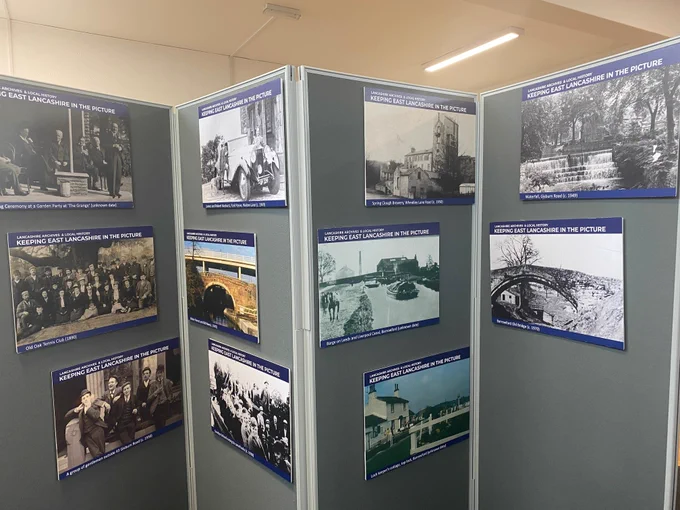 Colour photograph showing one side of the exhibition panels with photographs of Barrowford