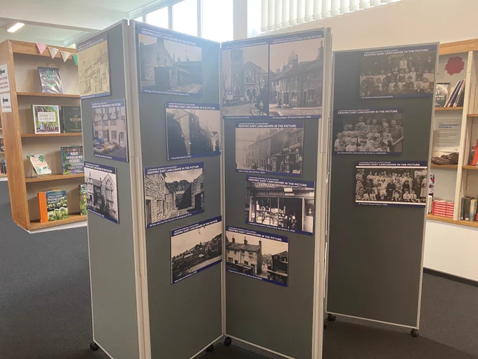 Colour photograph showing one side of the exhibition panels with photographs of Barrowford