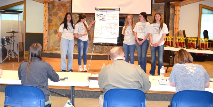 Judging: Students from West Fargo High School discuss their environmental plan during the 2024 North Dakota Envirothon May 10 at Crystal Springs Camp. The Bismarck NRCS sent a three-person team to assist in judging this year competition. (Photo by NRCS Public Affairs)