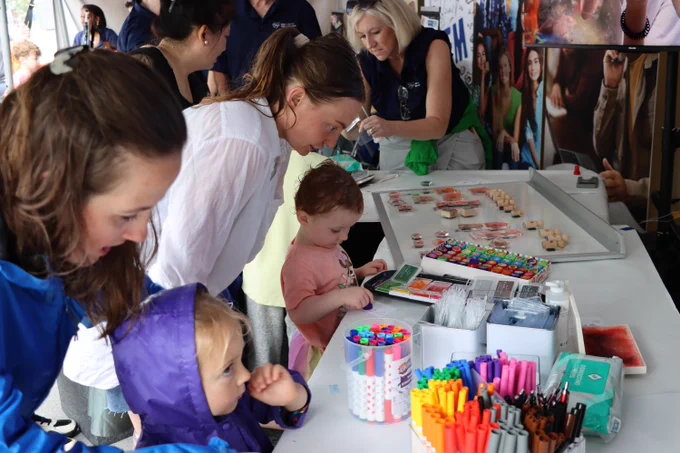 Visitors create custom backpack tags at the booth hosted by the Ohio Department of Higher Education. 