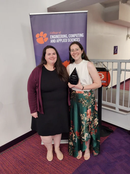 Shannon Conner, holding her award, stands next to Dr. Kelly Lazar.