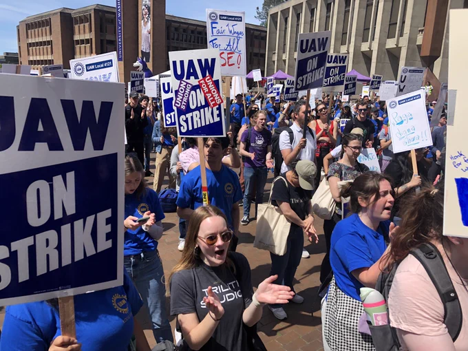 Large crowd of UAW members holding picket signs on Red Square