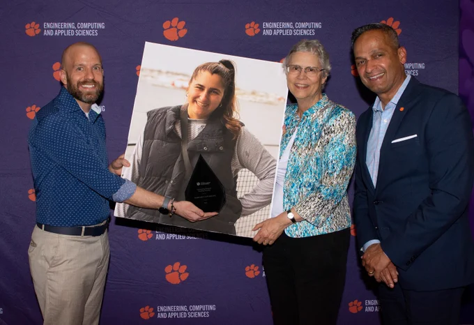 Drs. Matt Voigt and Cindy Lee of ESED pose with a picture of Margaret Ann, who couldn’t be at the ceremony. Alongside them is Dr. Anand Gramopadhye, Dean of CECAS.