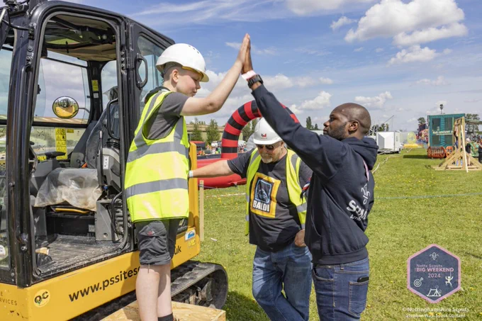 Dwayne Fields high-fives a young person at the Nottingham Scouts' Big Weekend