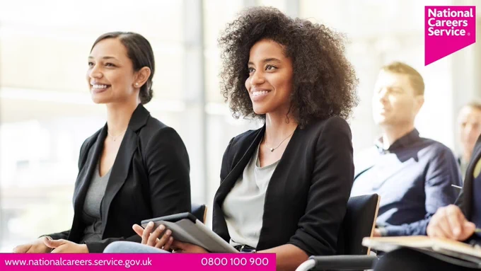 Two women in a training session at work. Top right is the National Careers Service logo and bottom left reads: "www.nationalcareers.service.gov.uk / 0800 100 900".