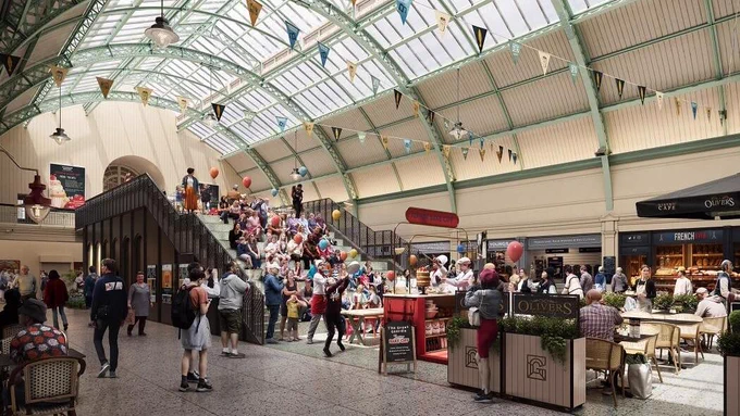 a crowd of people walk around the grainger market stalls in Newcastle