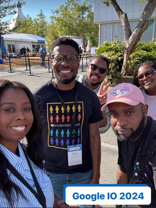 Group of people posing with text that reads Google IO 2024