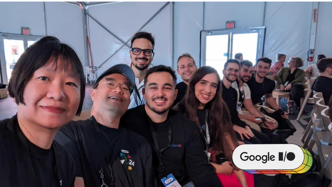 Group photo of nine people from the GDE community smiling  at the camera at the Google I/O event